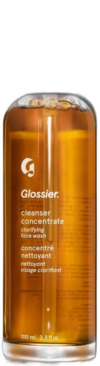 Glossier Cleanser Concentrate exfoliating face wash in a glass bottle with pump dispenser