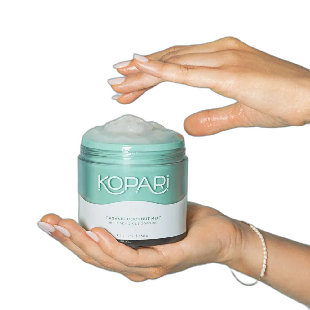 Kopari Coconut Melt in a clear glass jar showing solid white coconut oil with a screw-top lid