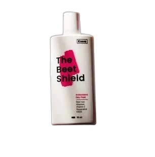 Krave Beauty The Beet Shield antioxidant day fluid bottle with green and beet-colored branding
