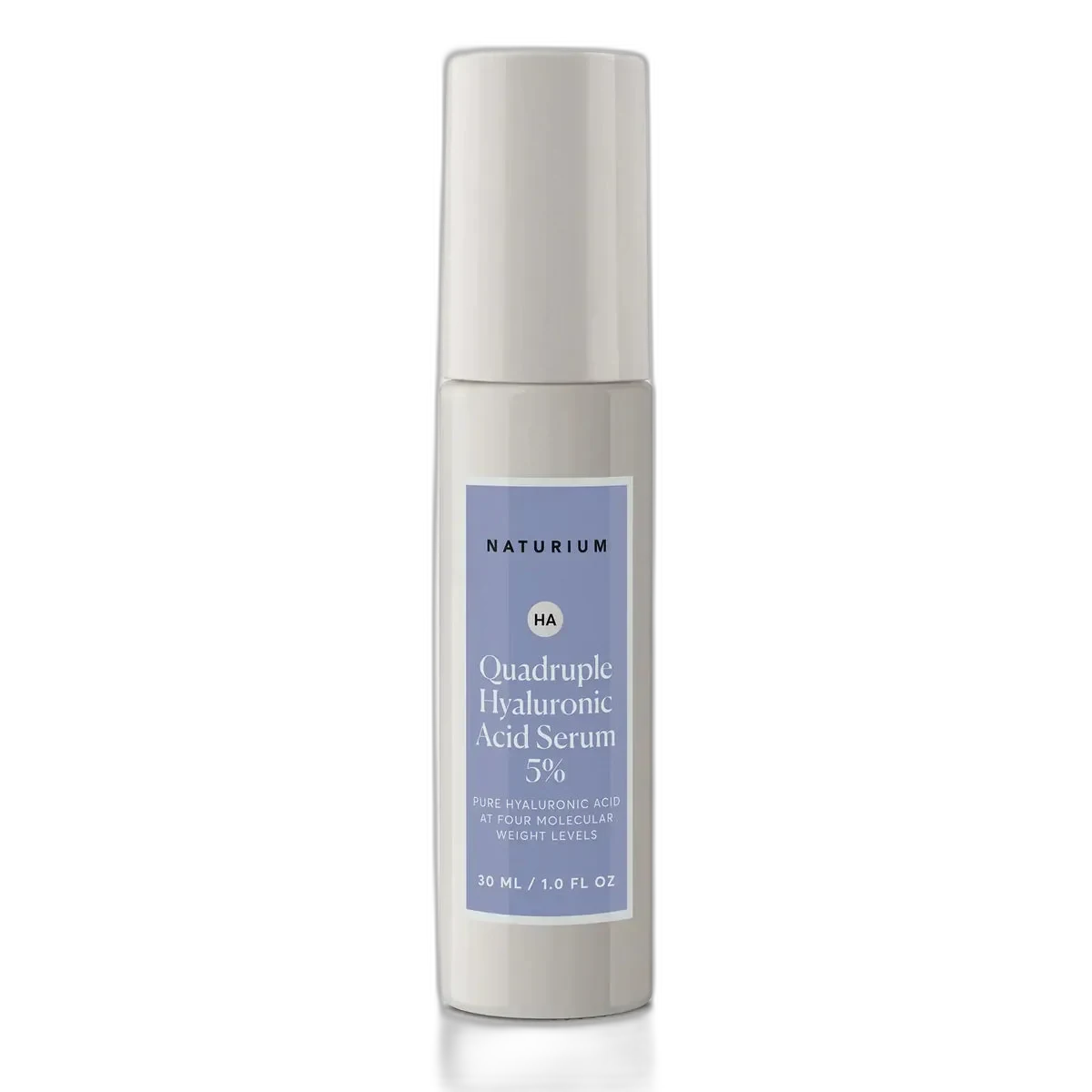 Naturium Quadruple Hyaluronic Acid Serum 5% glass dropper bottle with minimalist white and