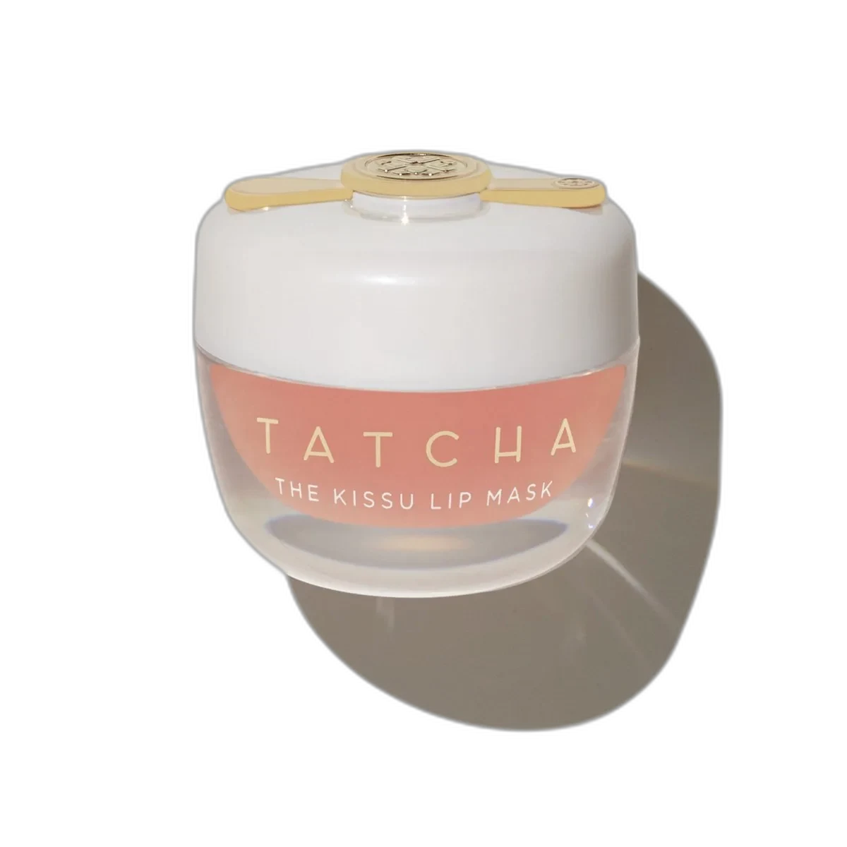 Tatcha The Kissu Lip Mask in a small glass pot with gold lid and spatula applicator